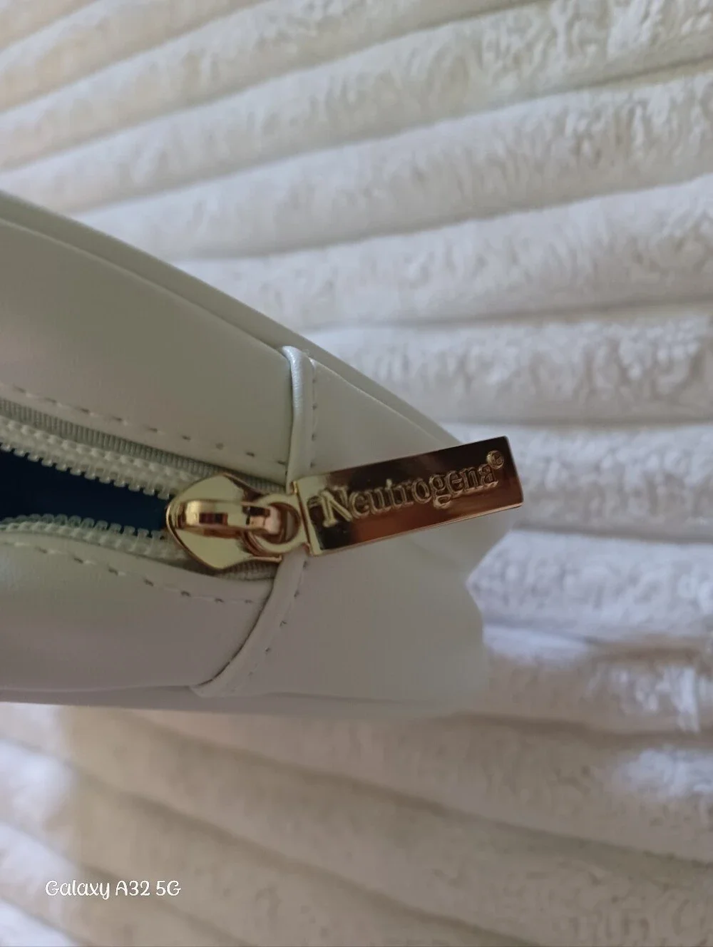 Neutrogena White Makeup Bag with Blue 'SKIN' Chenille Patch